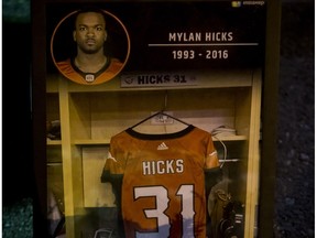 A candle sits snuffed out by wind during a candlelight vigil for Mylan Hicks at McMahon Stadium in Calgary, Alta., on Wednesday, Sept. 28, 2016. Hicks, a 23-year-old member of the Calgary Stampeders' practice roster, was shot and killed at Marquee Beer Market on the weekend.