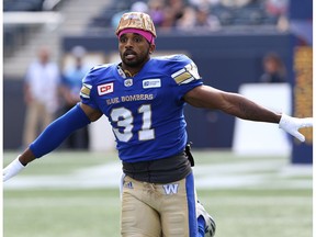 Winnipeg Blue Bombers DB Maurice Leggett flies out during warmup with a makeshift camouflage helmet before facing the Toronto Argonauts during CFL action in Winnipeg on Sat., Sept. 17, 2016.