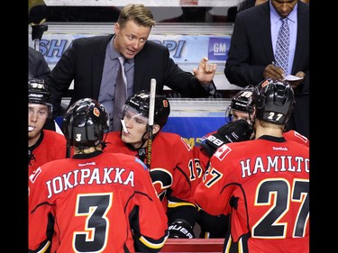 Calgary Flames head coach Glen Gulutzan gives final instructions to players before the sudden death overtime period against the Arizona Coyotes in NHL preseason action at the Scotiabank Saddledome in Calgary, Wednesday Oct. 5, 2016.