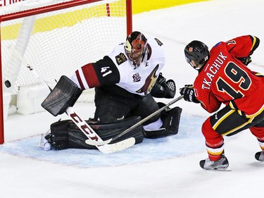The Calgary Flames' Matthew Tkachuk scores on Arizona Coyotes goaltender Mike Smith in the shoot out to win the NHL preseason game 2-1 at the Scotiabank Saddledome in Calgary, Wednesday Oct. 5, 2016.