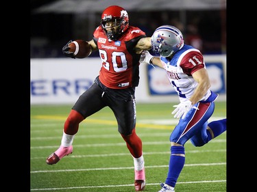 Calgary Stampeders wide receiver Jamal Nixon looks to avoid Montreal Alouettes linebacker Chip Cox during CFL action at McMahon Stadium in Calgary on Saturday October 15, 2016. Gavin Young/Postmedia