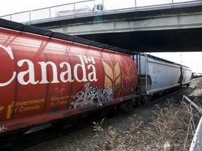 A Canadian Pacific Rail train hauling grain passes through Calgary in a May 1, 2014, file photo. THE CANADIAN PRESS/Jeff McIntosh