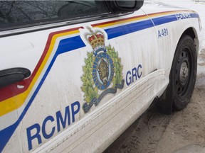 A RCMP cruiser is seen outside a home in La Loche, Sask. Monday, Jan. 25, 2016. A 17-year-old youth allegedly shot two brothers to death at the home on Friday before making his way to the La Loche Community School where he allegedly shot and killed two others and left another seven in critical condition. THE CANADIAN PRESS/Jonathan Hayward
