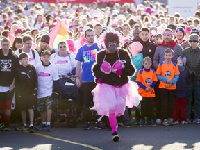 A gorilla leads the starting-line charge during the Canadian Breast Cancer Foundation CIBC Run for the Cure at Southcentre Mall in Calgary, Alta., on Sunday, Oct. 2, 2016. About 7,500 people took part in the 5-km and 1-km runs.