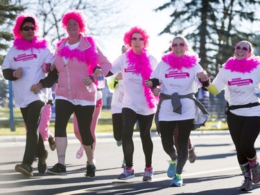 A group approaches the finish line in the Canadian Breast Cancer Foundation CIBC Run for the Cure at Southcentre Mall in Calgary, Alta., on Sunday, Oct. 2, 2016.