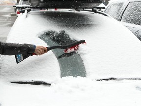 A motorist cleans her car in this file photo.
