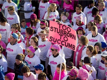 A throng walks through the start line of the Canadian Breast Cancer Foundation CIBC Run for the Cure at Southcentre Mall in Calgary, Alta., on Sunday, Oct. 2, 2016. About 7,500 people took part in the 5-km and 1-km runs.