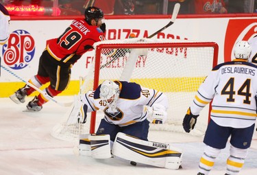 Calgary Flames Matthew Tkachuk celebrates after scoring his first NHL goal on Buffalo Sabres goalie Robin Lehner during NHL hockey in Calgary, Alta., on Tuesday, October 18, 2016. AL CHAREST/POSTMEDIA