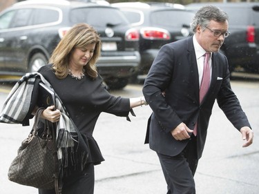 Interim Conservative Leader Rona Ambrose, left, and her husband JP Veitch arrive at the state memorial for former Alberta premier Jim Prentice in Calgary, Alta., on Friday, October 28, 2016. Prentice was among four people killed in a small-plane crash in British Columbia. THE CANADIAN PRESS/Jason Franson ORG XMIT: EDM105