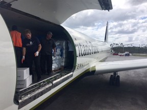 An aircraft arrives in the Bahamas with hurricane relief supplies.