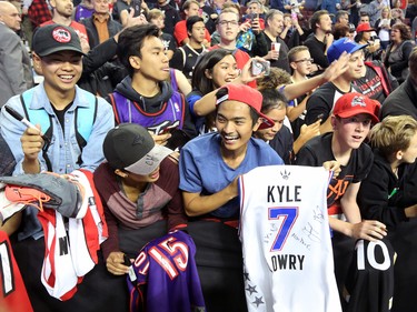 Excited basketball fans wait for autographs for before the NBA preseason game between the Denver Nuggets and Toronto Raptors at the Scotiabank Saddledome in Calgary on Monday Oct. 3, 2016.