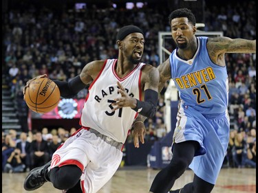 The Toronto Raptors' Terence Ross looks to go around Denver Nuggets' Wilson Chandler during their NBA preseason game at the Scotiabank Saddledome in Calgary on Monday Oct. 3, 2016.