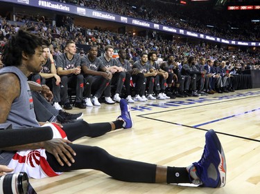 The Toronto Raptors team watches the action during the NBA preseason game between the Denver Nuggets and Toronto Raptors at the Scotiabank Saddledome in Calgary on Monday Oct. 3, 2016.