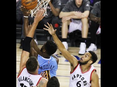 The Toronto Raptors' Cory Joseph, right reaches for the rebound during an NBA preseason game between the Denver Nuggets and Toronto Raptors at the Scotiabank Saddledome in Calgary on Monday Oct. 3, 2016.