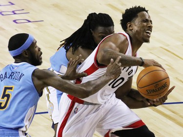 The Toronto Raptors' DeMar DeRozan fights to get close to the net during an NBA preseason game between the Denver Nuggets and Toronto Raptors at the Scotiabank Saddledome in Calgary on Monday Oct. 3, 2016.