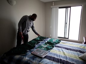 Calgary Stampeders defensive back Osagie Odiase was Mylan Hicks' roommate. It has been tough for Odiase alone in the apartment he shared with his friend. Odiase has kept Hick's bedroom tidy and placed his favourite Michigan State college gear and Stampeders playbook on Hicks' bed. Odiase was photographed on Wednesday October 5, 2016.