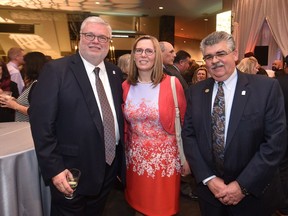 Cal 1029 SAIT 6  Pictured, from left,  with reason to smile at the wonderful celebration of SAIT's 100th anniversary held Oct 13 in the Jube are Dr. David Ross, president and CEO of the Southern Alberta Institute of Technology, his wife Ewa, and Doug Ramsay, the recipient of SAIT's 2012 Distinguished Alumni award, a member of SAIT's board of governors and vice- chairman of the board of directors of Calfrac Well Services Ltd.