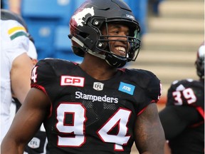 Calgary Stampeders defensive lineman Frank Beltre smiles after stopping an Edmonton Eskimos play in the second half of the CFL Labour Day Classic in Calgary on Monday September 5, 2016.