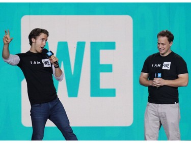 Craig, left, and Marc Kielburger talk on stage at the WE Day event at the Scotiabank Saddledome in Calgary on Wednesday October 26, 2016.