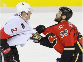 Calgary Flames Deryk Engelland exchanges a few words with Ottawa Senators Dion Phaneuf in NHL hockey action at the Scotiabank Saddledome in Calgary, Alta. on Friday October 28, 2016. The Flames beat the Senators 5-2.