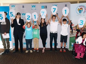 Representatives from some of the 124 youth based beneficiaries of the Shaw Charity Classic reveal the record-setting donation of $5,217,713 raised in this year's Shaw Charity Classic golf tournament. The announcement took place at the Canyon Meadows Golf Club on Thursday Oct. 20, 2016.  GAVIN YOUNG/POSTMEDIA