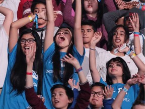 Students cheer during WE Day at the Scotiabank Saddledome in Calgary on Wednesday October 26, 2016.