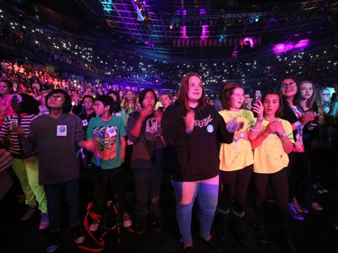 Students watch the action on the stage during the WE Day event at the Scotiabank Saddledome in Calgary on Wednesday October 26, 2016.