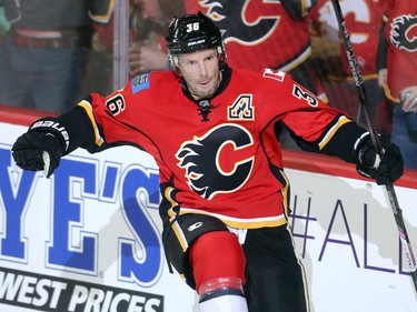 Troy Brouwer of the Calgary Flames celebrates his goal late in the second period that brought the Flames to within 2 of the Carolina Hurricanes at the Saddledome Thursday night October 19, 2016.
