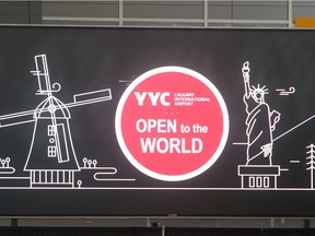 The YYC Open to the World logo overlooking the concourse of the new International Terminal as seen on an advance tour Monday October 3, 2016. The terminal, serving US and International flights,  is set to open at the end of October. (Ted Rhodes/Postmedia Calgary)