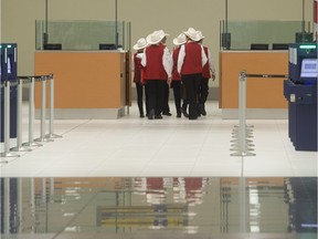 A group of White Hat volunteers get a rare tour through the soon to be open US Customs at the new Calgary Airport International Terminal.