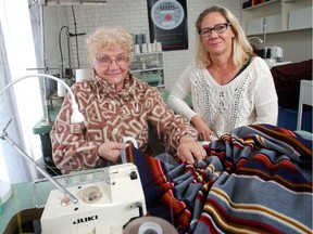 Sylvia Rempel, left, and Angela Grams, the mother and daughter partners behind Sewing Seeds Canada, at the sewing machines they use for training in their Calgary training centre and showroom.  The charity trains women in Third World countries to sew and become bread winners.