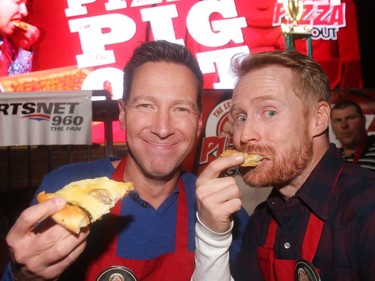 Eric Francis and Olympian and Amazing Race host Jon Montgomery try out some slices at his annual Eric Francis Pizza Pigout Wednesday night October 19, 2016 at Cowboys.