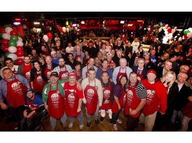 The pizza connoisseurs gather for a group photo at the close of the annual Eric Francis Pizza Pigout Wednesday night October 19, 2016 at Cowboys.