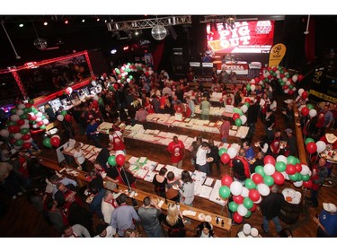 The crowds peruse the pizza offerings at the annual Eric Francis Pizza Pigout Wednesday night October 19, 2016 at Cowboys.