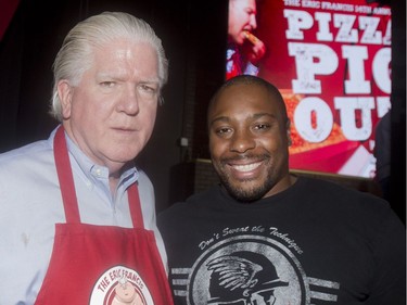 Calgary Flames General Manager Brian Burke and former Calgary Stampder, now a Montreal Alouette, Nik Lewis, two of the celebrities at the annual Eric Francis Pizza Pigout Wednesday night October 19, 2016 at Cowboys.
