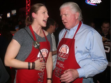 Calgary Flames General Manager Brian Burke chats with former Team Canada Rugby player Maria Samson at the annual Eric Francis Pizza Pigout Wednesday night October 19, 2016 at Cowboys.