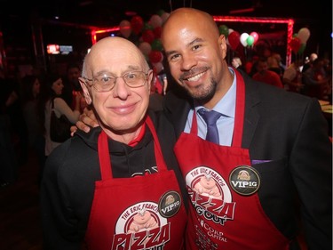 Retired University of Calgary Sports Information Director Jack Neuman chats with retired Calgary Stampeder Jon Cornish at the annual Eric Francis Pizza Pigout Wednesday night October 19, 2016 at Cowboys.