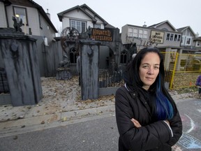 Chrissy Oliver stands outside the sprawling haunted house that fills her entire southwest yard.