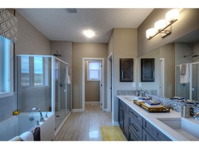 The ensuite in the Bentley II show home by NuVista Homes in Dressage in Silverado.