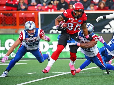 Calgary Stampeders wide receiver Jamal Nixon runs the ball as he dodges Montreal Alouettes players during CFL action at McMahon Stadium in Calgary on Saturday October 15, 2016. Gavin Young/Postmedia