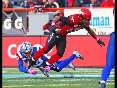 Calgary Stampeders receiver Marquay McDaniel runs the ball as he dodges Montreal Alouettes players during CFL action at McMahon Stadium in Calgary on Saturday October 15, 2016. Gavin Young/Postmedia