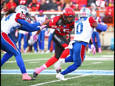 Calgary Stampeders defensive back Shaquille Richardson  looks to intercept Montreal Alouettes running back Stefan Logan during CFL action at McMahon Stadium in Calgary on Saturday October 15, 2016. Gavin Young/Postmedia