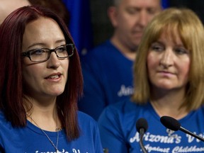Dani Polsom (left), next to her mother Alison Jones, speaks about her sexual abuse case at a Wildrose Party press conference held at the Alberta Legislature Annex building  in Edmonton, Alta., on Monday, April 15, 2013. In October 2012, the case against her abuser was thrown out of court due to delays, which the political party is proposing measures to address. Ian Kucerak/Edmonton Sun/QMI Agency