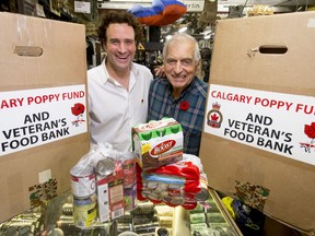 FILE PHOTO: Dave Howard (L) and Gord Cumming, co-founders of the Canadian Legacy Project's annual Veterans Food Drive, pose for a photo at drop-off point Crown Surplus in Calgary, Alta., on Thursday, Oct. 29, 2015.