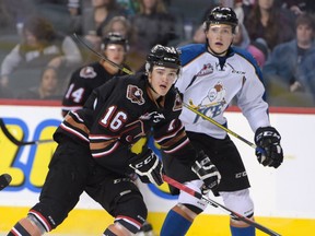 Dawson Martin of the Calgary Hitmen looks to receive a pass at the regular season home opener against the Kootenay Ice at the Scotiabank Saddledome on Friday, Sept. 23, 2016.