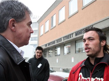 Calgary-08/12/06-Alberta regional minister and Indian Affairs Minister Jim Prentice talks to homeless person Yannick Paquette while touring the Mustard Seed Ministry Thursday to see the problems facing Calgary's homeless and how federal money is being spent. Photo Credit: Jenelle Schneider/Calgary Herald for City story by Jason Fekete. Story ID#00008628A