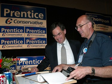 June 2004: Jim Prentice and his campaign co-chair Don Brooks look through poll results at the Roundup Centre.