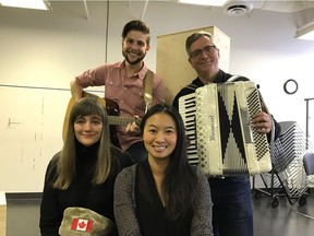 Elinor Holt, front left, beside Selina Wong. Eric Wigston standing beside Joe Slabe with the accordion. Credit, Lunchbox Theatre