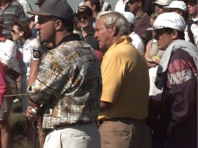 Arnold Palmer keeps an eye on a drive during an exhibition event in Calgary on Labour Day weekend in 1995. Gord Courage (finger on mouth) was part of the foursome at Hamptons that included Palmer and Gary Player. DAVID LAZAROWYCH photo * Calgary Herald Merlin Archive * ORG XMIT: POS2016093014293133