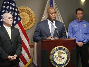 FBI Special Agent in Charge Eric Jackson talks about the FBI's roll in stopping a bomb plot. Acting U.S. Attorney Tom Beall (left) announced Friday a major federal investigation stopped a domestic terrorism plot by a militia group to detonate a bomb at a Garden City apartment complex where a number of Somalis live.Two Liberal men and a Dodge City resident were arrested and charged in federal court with domestic terrorism charges, Beall told reporters at a news conference in downtown Wichita. (Bo Rader/The Wichita Eagle via AP) ORG XMIT: KSWIE106